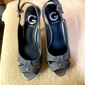 Like new! Silver sparkly Guess Heels with peep toe and ankle strap. Size 6.